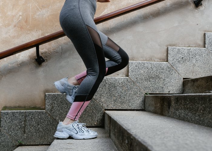 woman walking up stairs during functional training exercise
