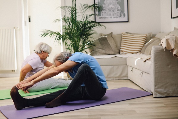 Seniors doing yoga for exercise in their Florida home