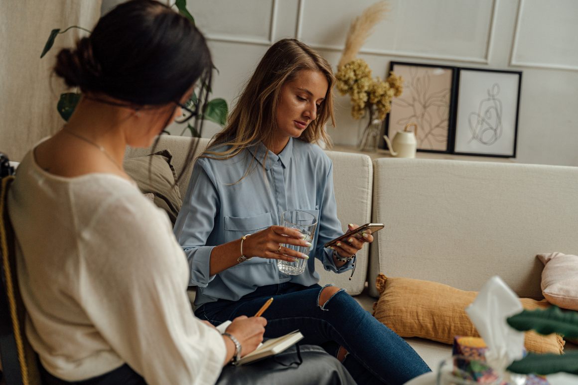 Two women discussing mental health and technology in St. Petersburg, Florida