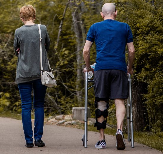 Florida patient learning how to walk with a rollator walker in Tampa